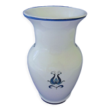 White-blue earthenware vase with stylized plant decoration