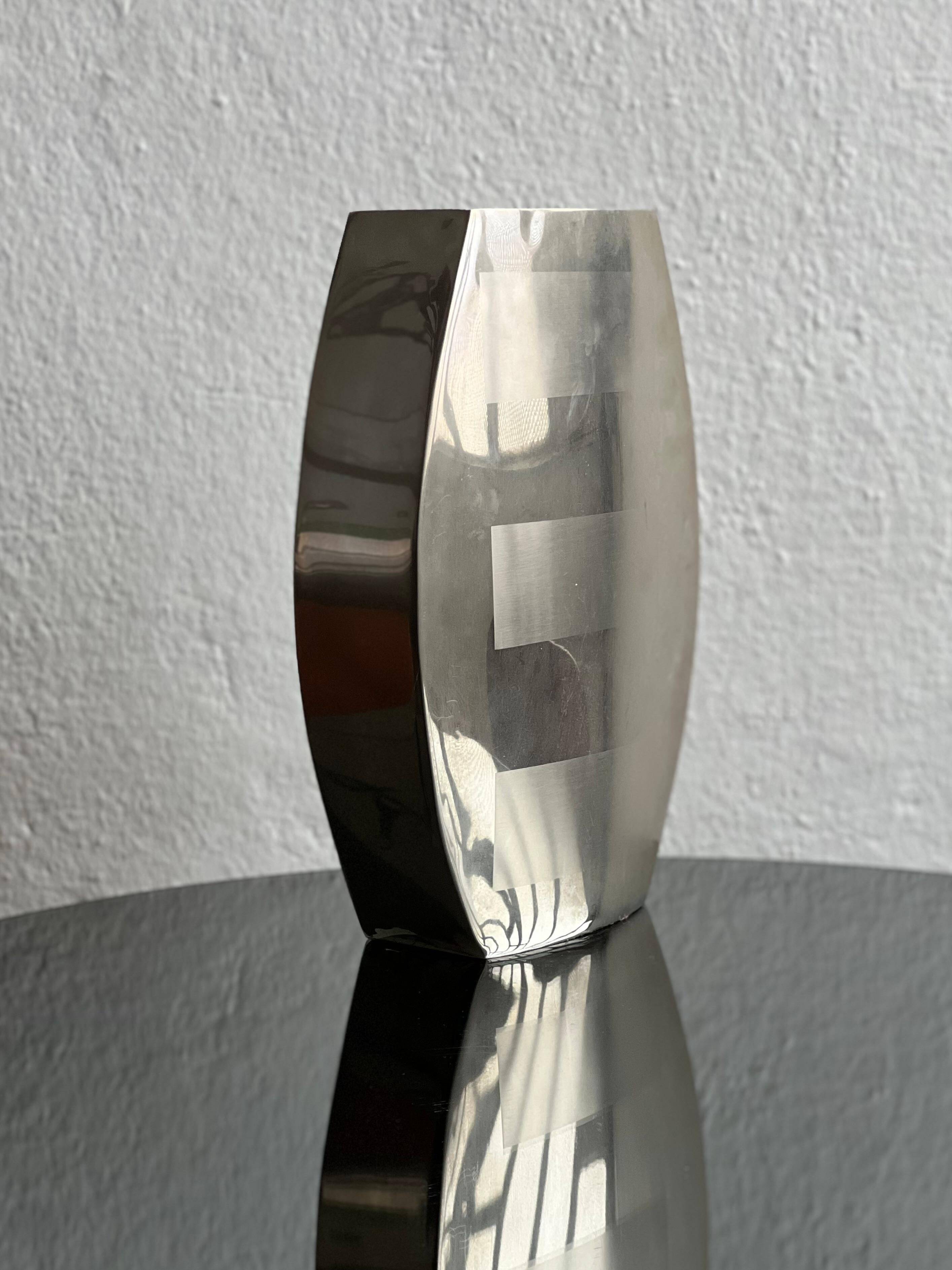 Decorative stainless steel vase with geometrical shapes imprinted, 1970's