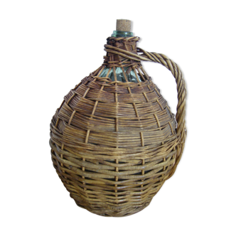 Demijohn dressed in wicker with handle