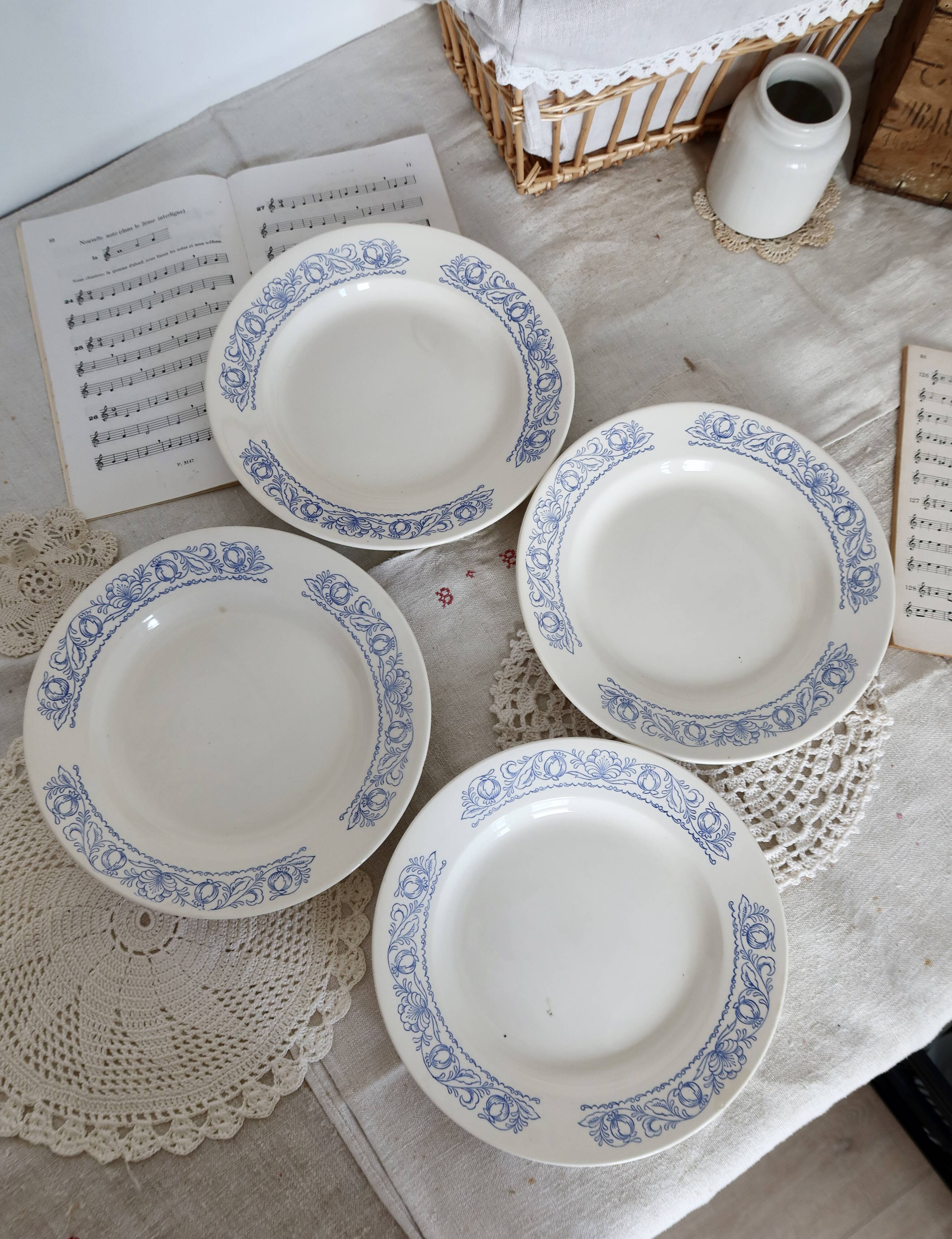 4 vintage white soup plates with blue border