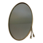 Miroir ovale entouré d'une cordelette en laiton