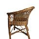 Vintage, children's armchair in woven rattan from around 1970.