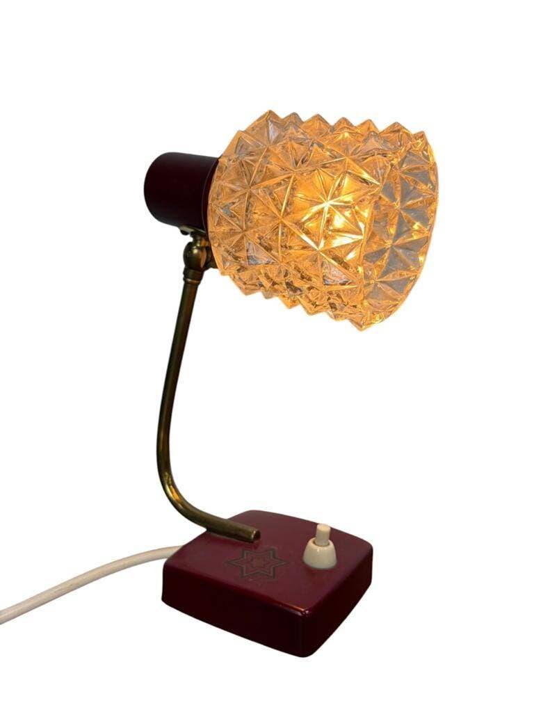 Vintage burgundy table lamp with glass shade.