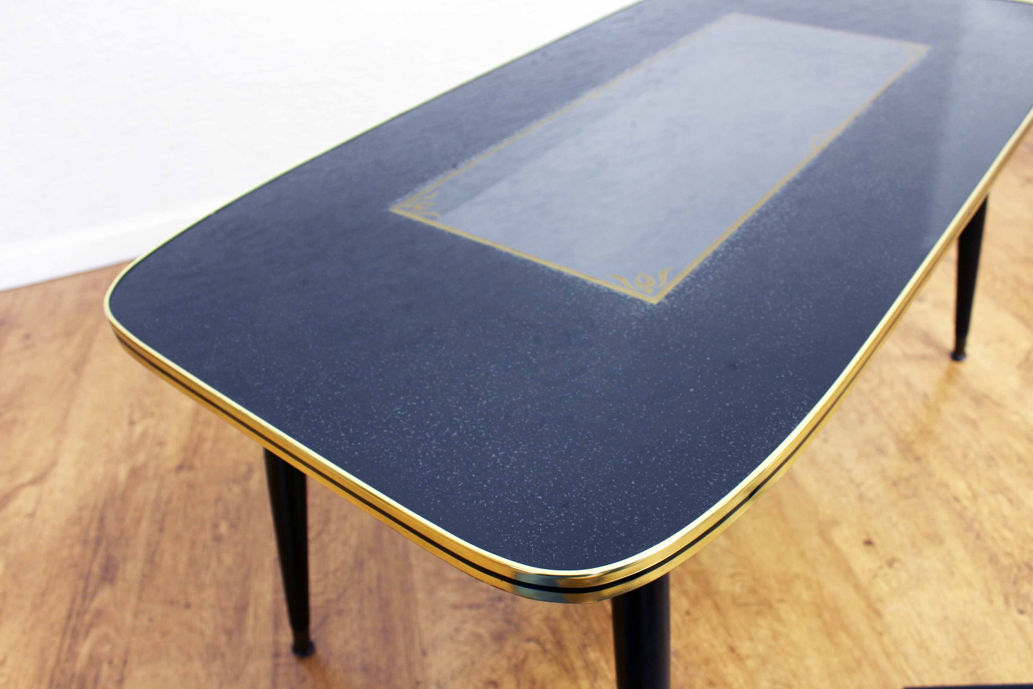 Low table with compass feet with decorative cabinet