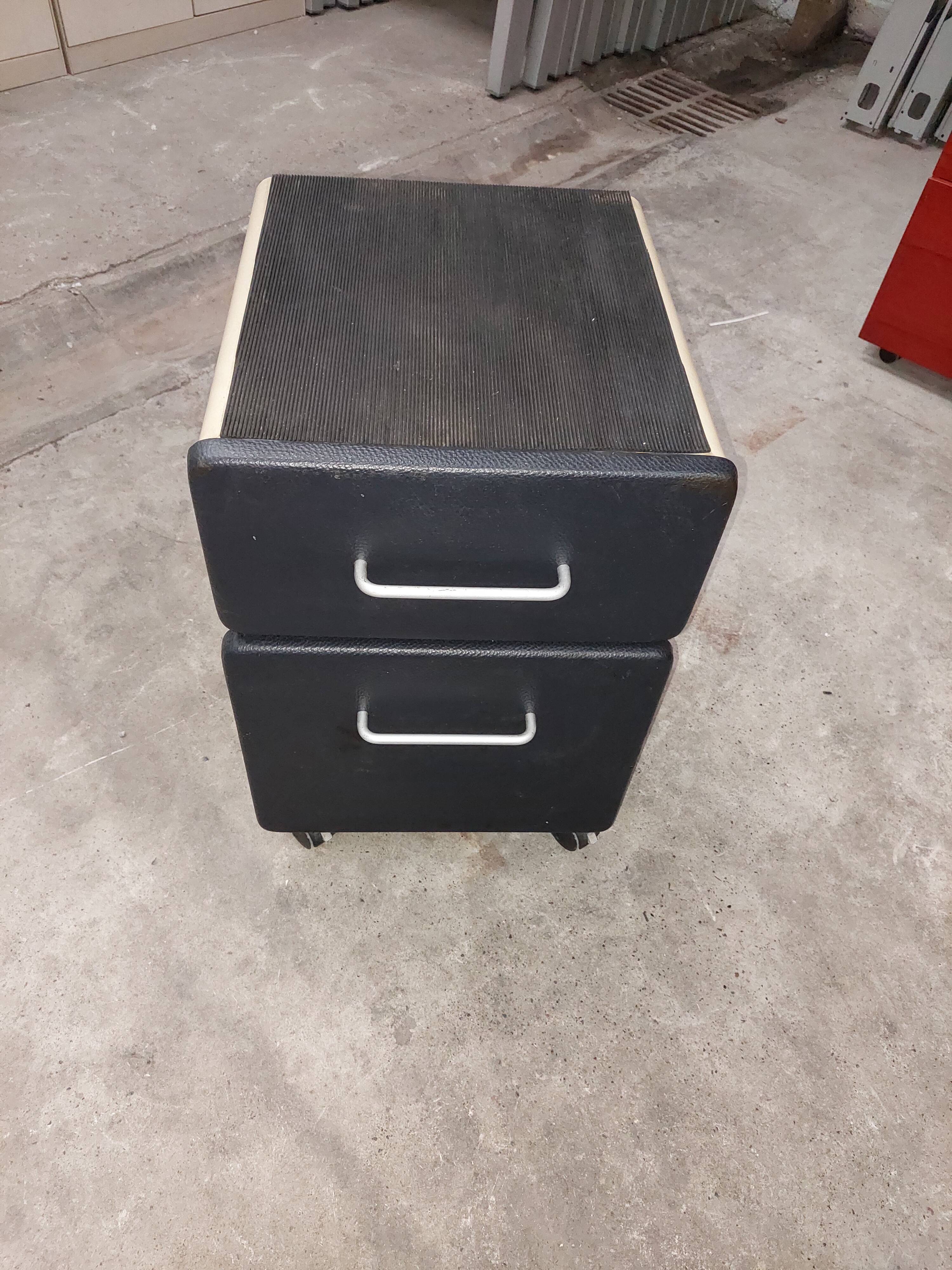 Metal box with used vintage keyless casters