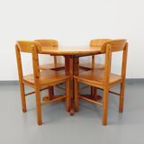 Suite of a round table with extension and 4 vintage pine chairs from the 60s and 70s