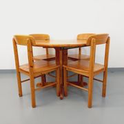 Suite of a round table with extension and 4 vintage pine chairs from the 60s and 70s