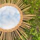 Vintage sun mirror in braided rattan and bamboo 60s/70s.