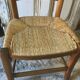 Chaise basse paillée de nourrice en merisier