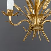 Golden suspension on ears of wheat, circa 1960