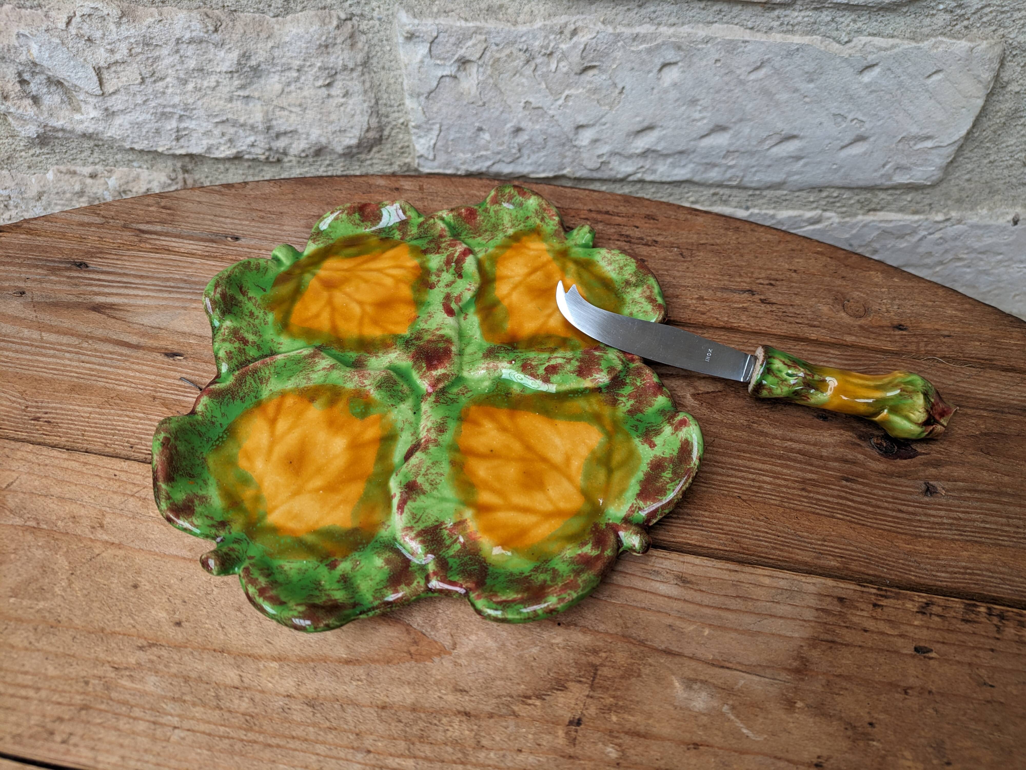 Antique colored ceramic cheese plate with knife
