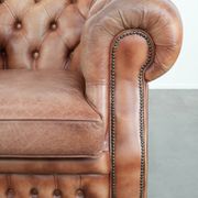 Chesterfield armchair in English style made of cowhide leather