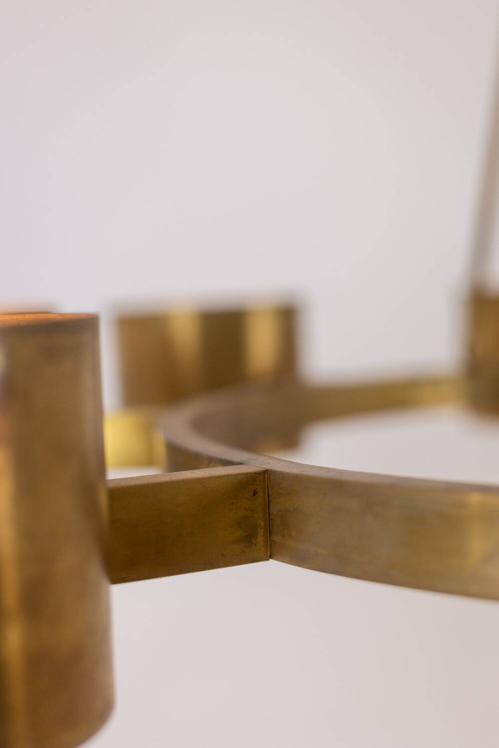 Matte gold brass circular chandelier. Contemporary Italian work.