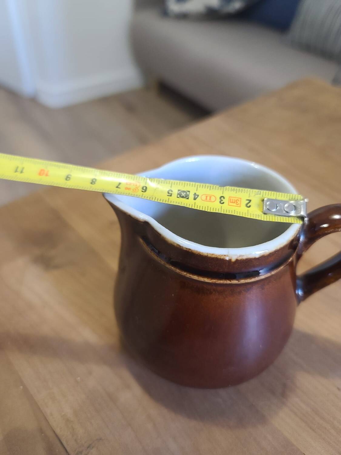 Brown ceramic milk jug