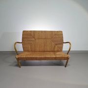 Vintage French papercord sofa with a metal frame base