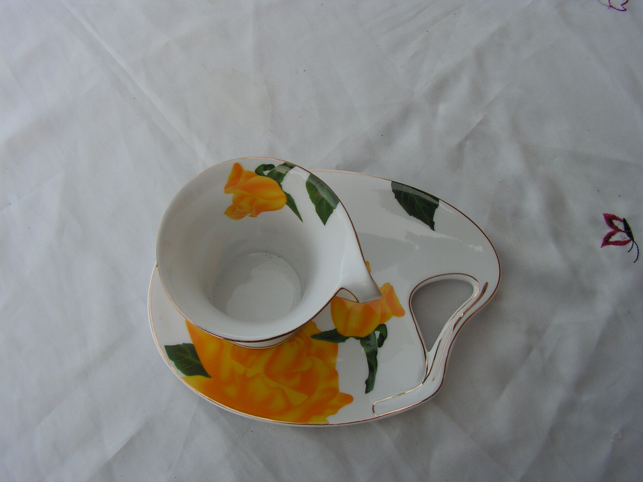 So french design porcelain cup and under cup