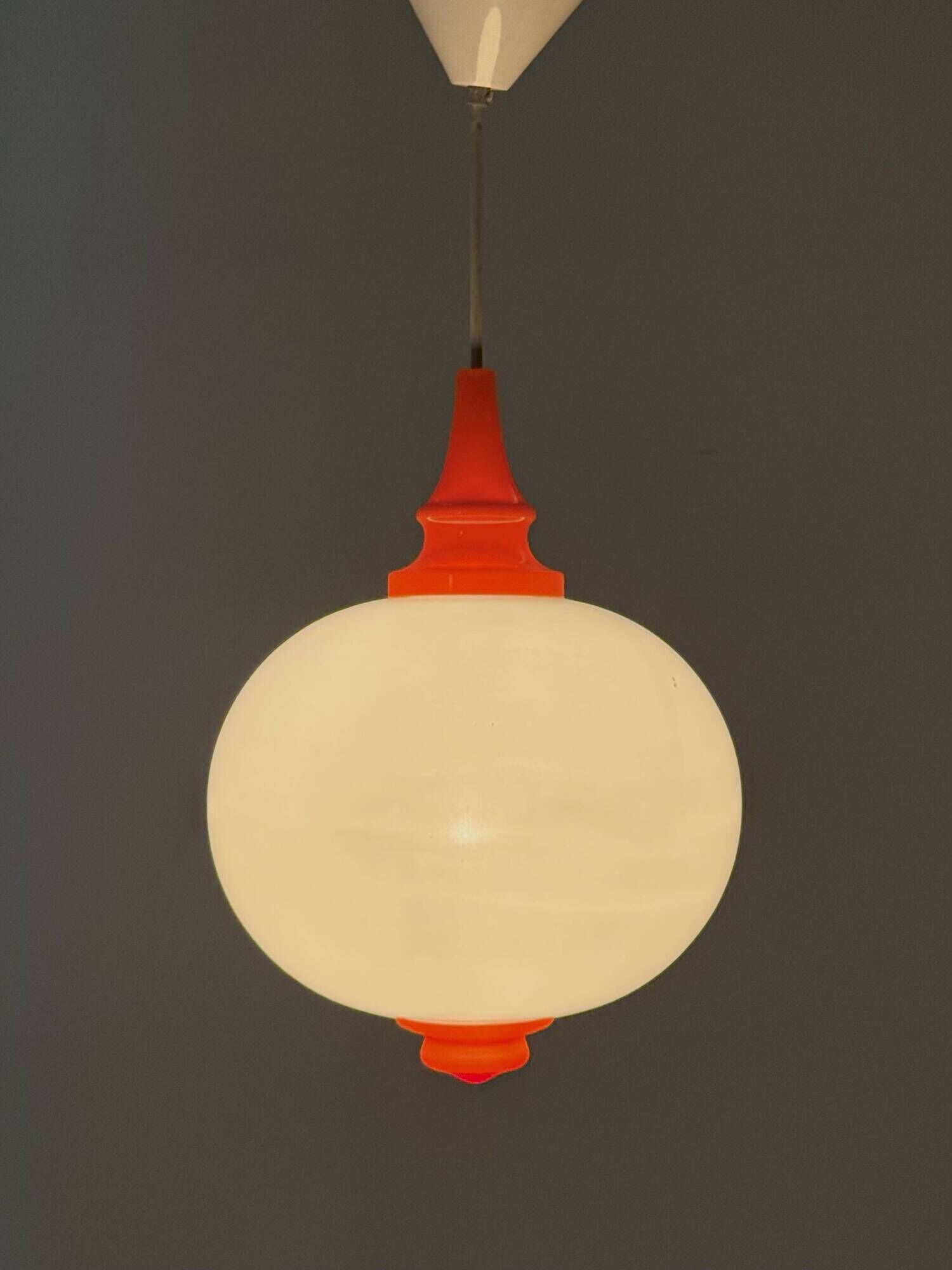 Space Age pendant lamp with milk glass ball and orange accents