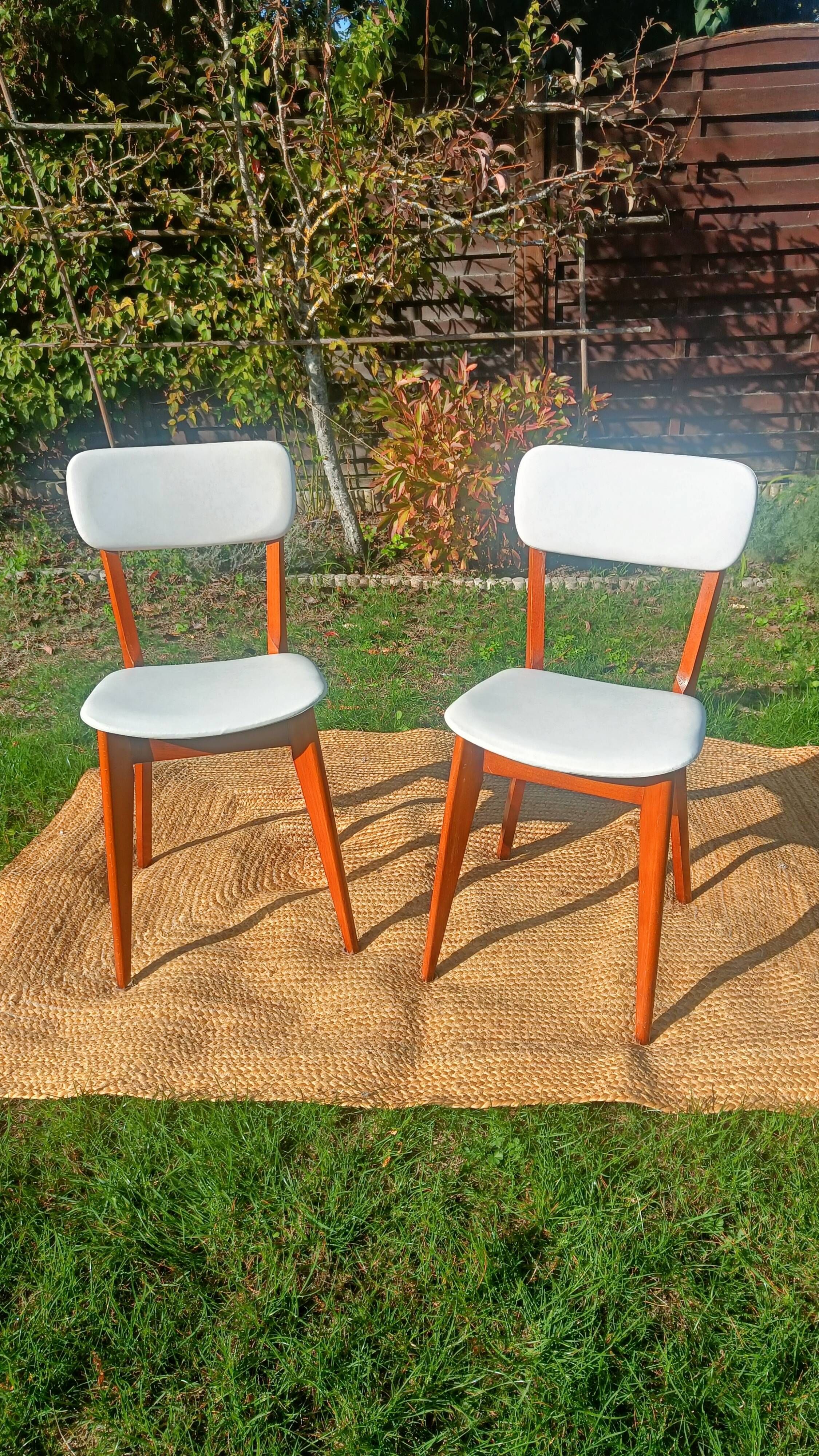 vintage wooden chairs with white faux leather