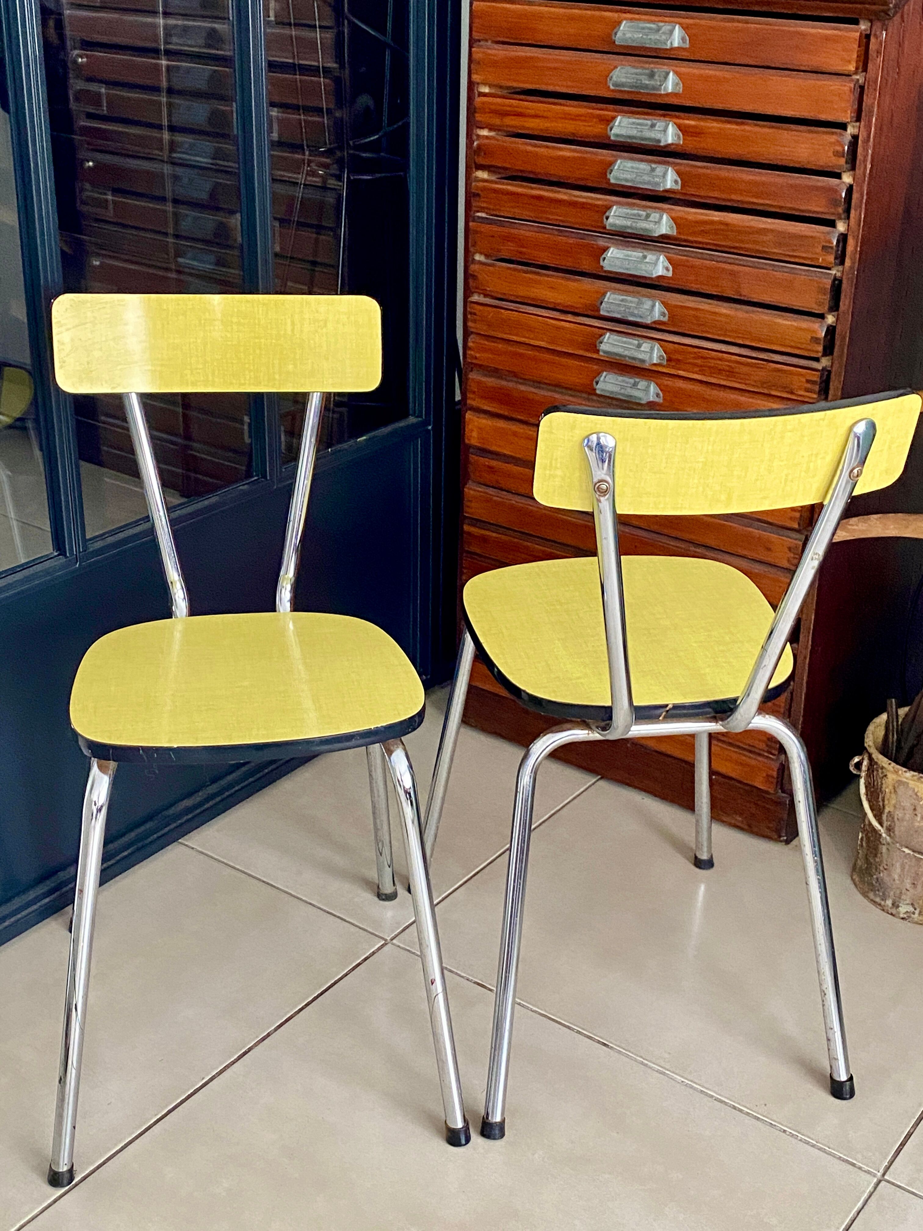 Pair of yellow formica chairs