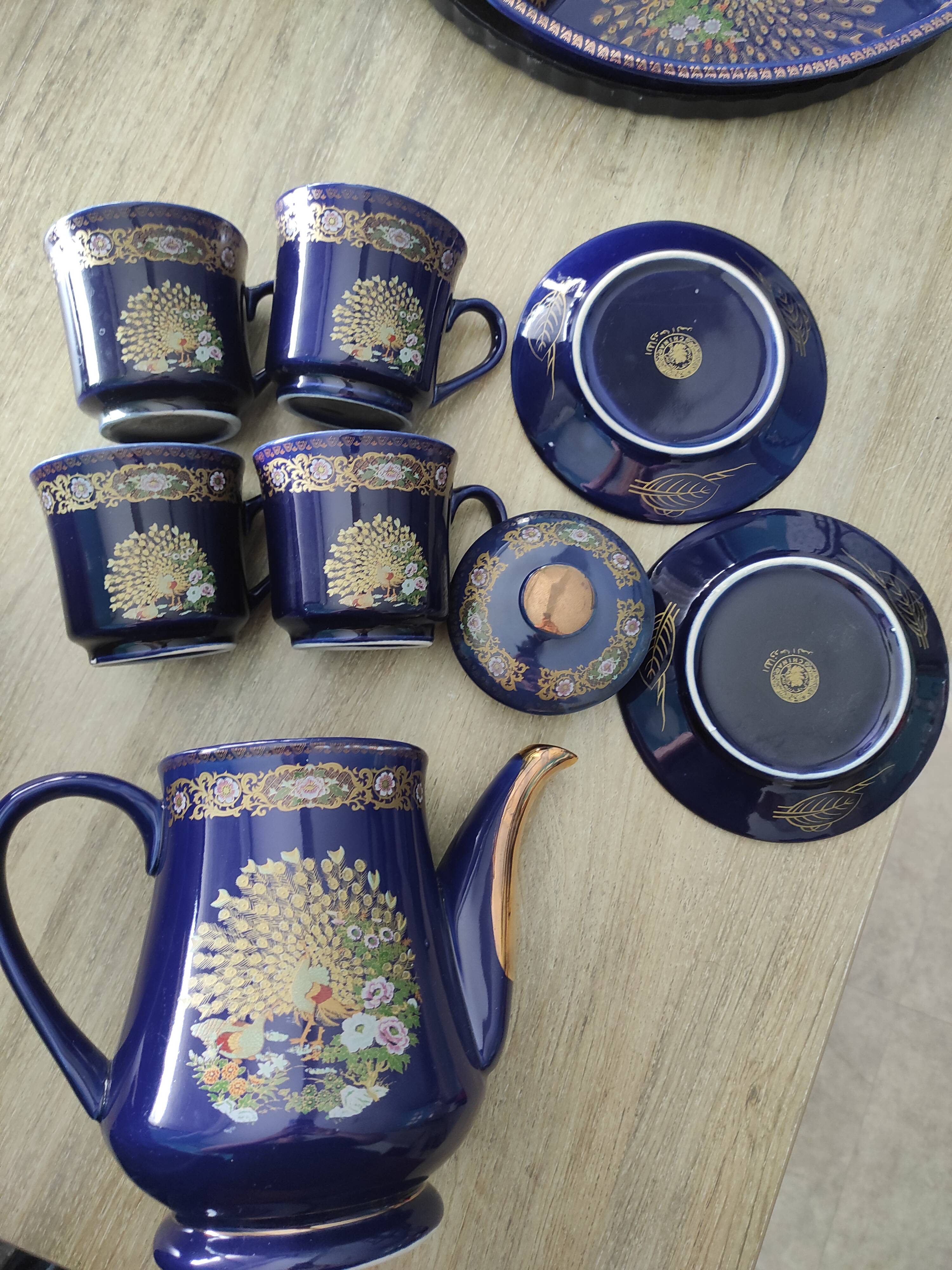 Vintage blue Taous dinnerware set of 21 pieces in very good overall condition.