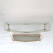 Hollywood Regency console table in lucite, glass and gold metal. 1980s