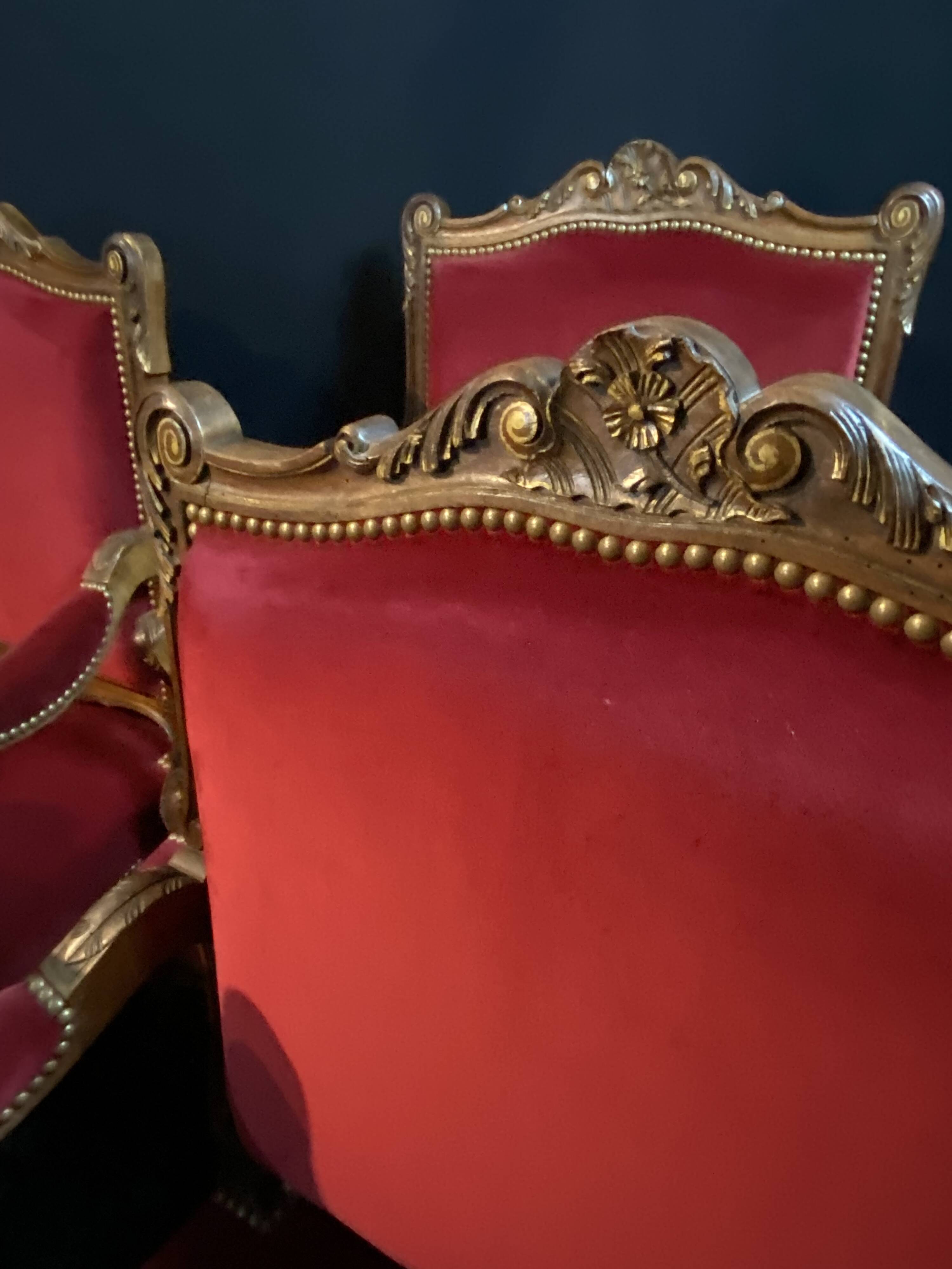 Pair of flat-back armchairs in Louis XV style in red velvet.
