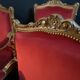 Pair of flat-back armchairs in Louis XV style in red velvet.
