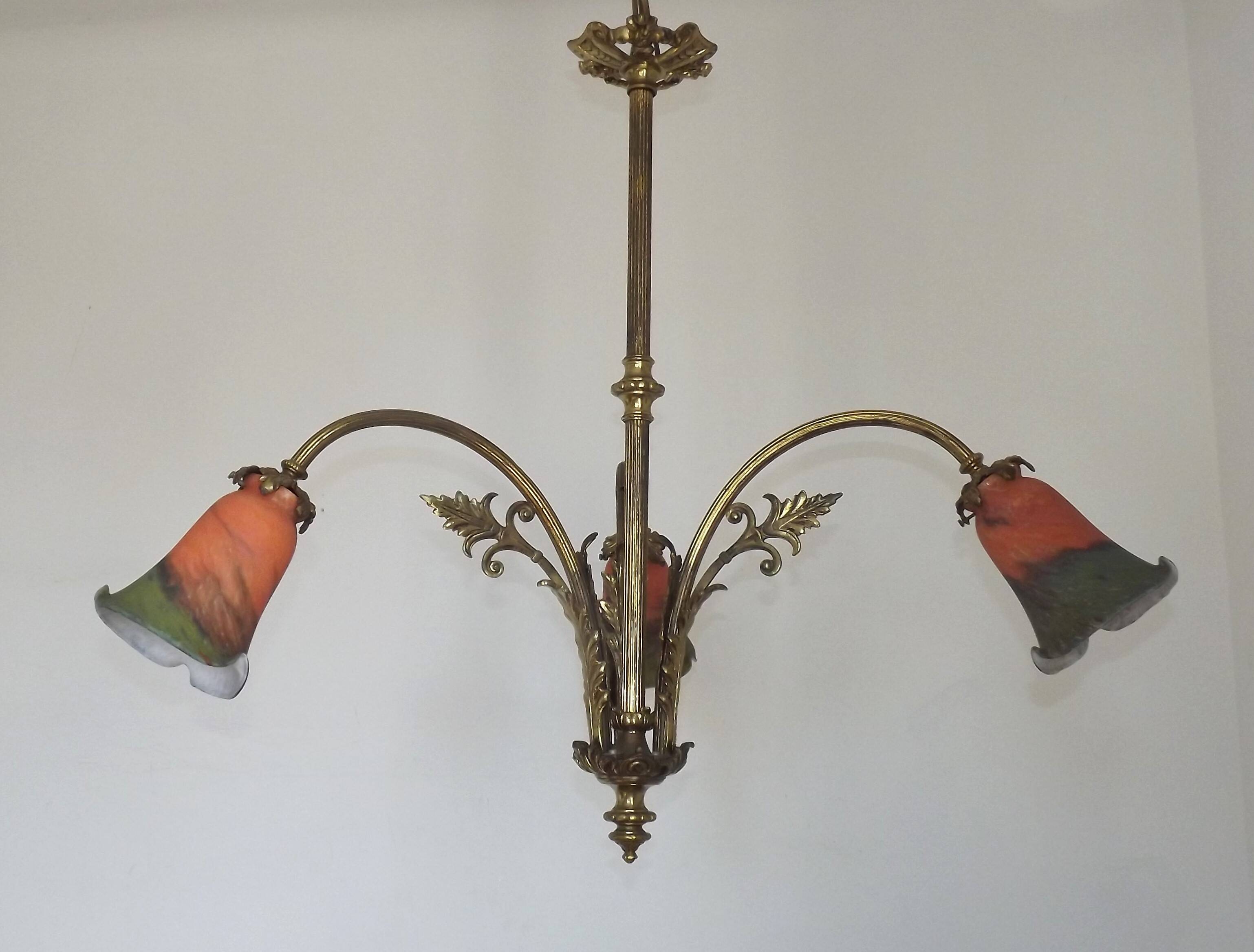 Art Nouveau three-light chandelier in bronze with orange and green glass shade, France.