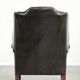 Vintage cowhide leather Chesterfield wingback armchair in a green colour