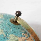 Luminous world map in tripod glass