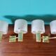 Pair of brass and gold plastic sconces with granite lampshades, France 1950
