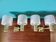 Pair of brass and gold plastic sconces with granite lampshades, France 1950