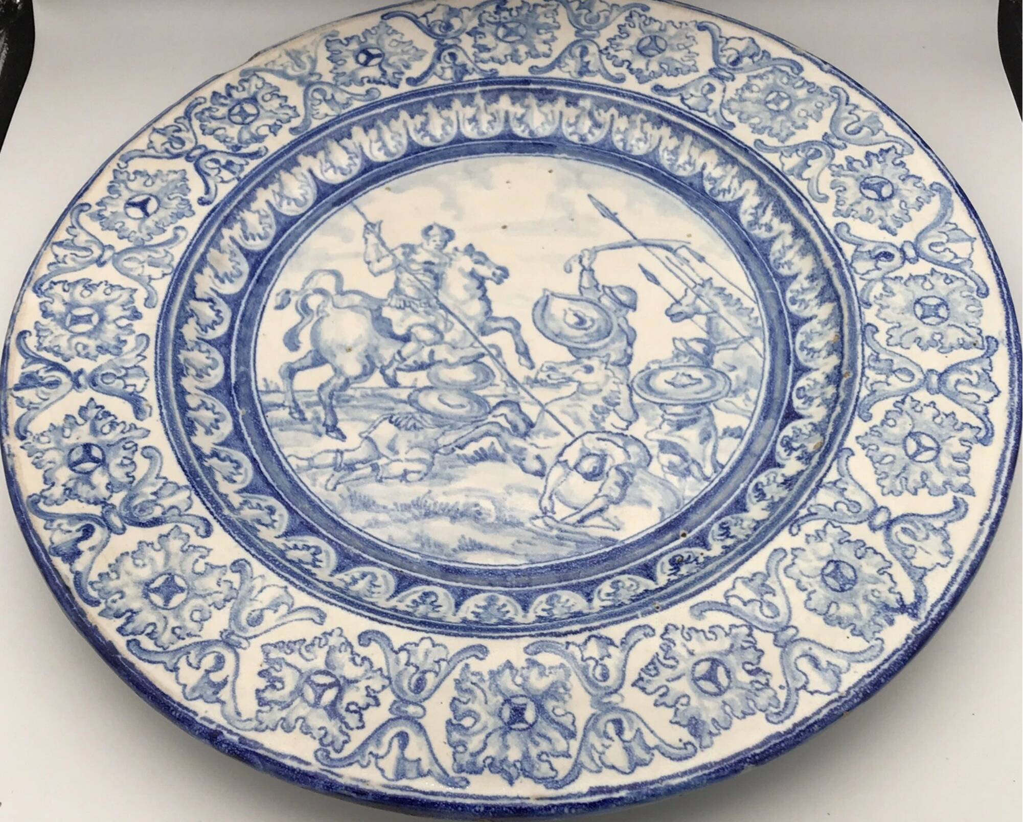 Antique glazed ceramic wall plate with battle scene decoration 41.5 cm