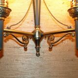 Brass wall sconce and frosted globe