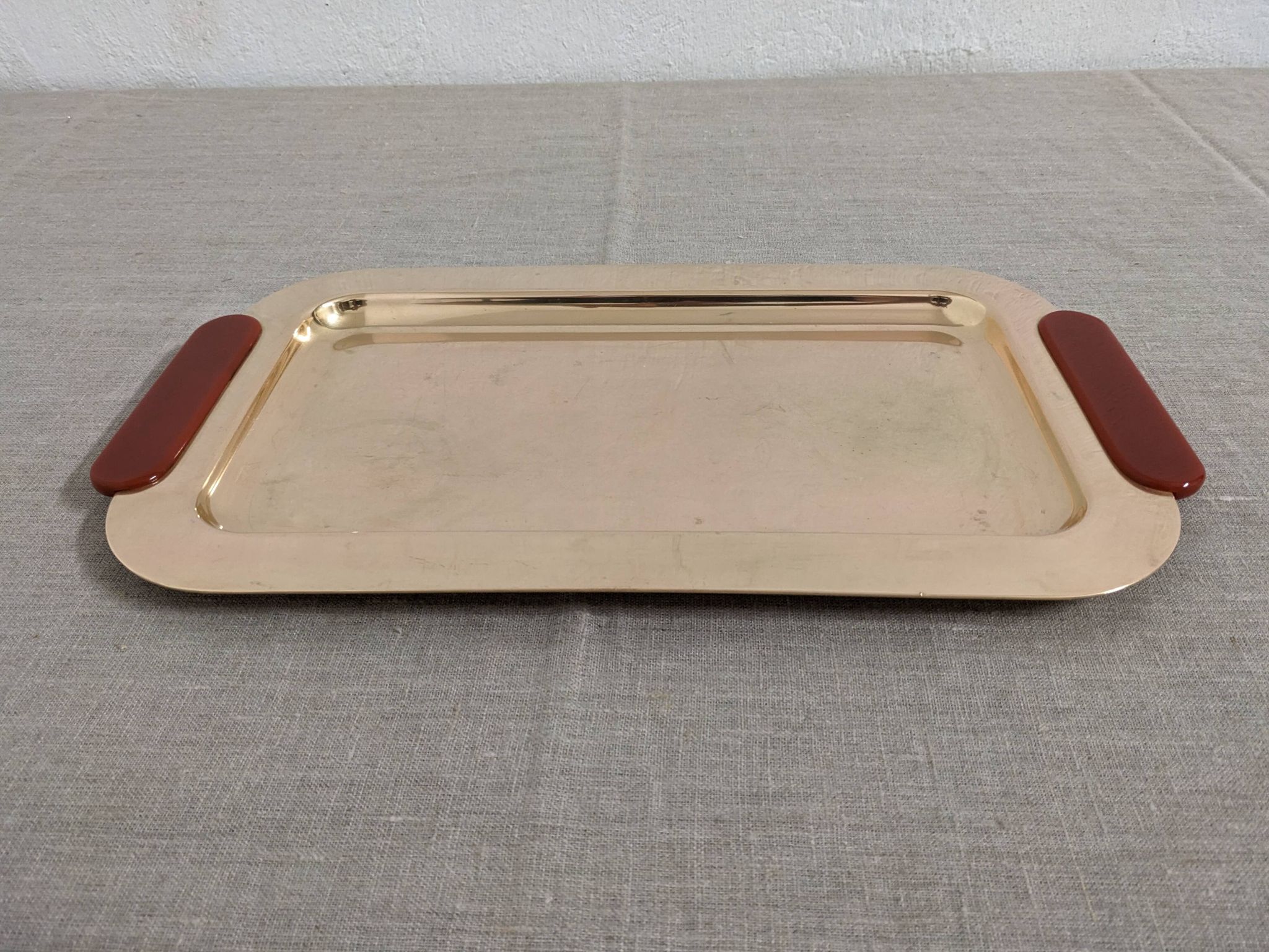 Plates and a brass and Bakelite cut by PM Italy, Italy around 1970.