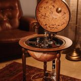 Large bar globe with internal compartment for bottles.
