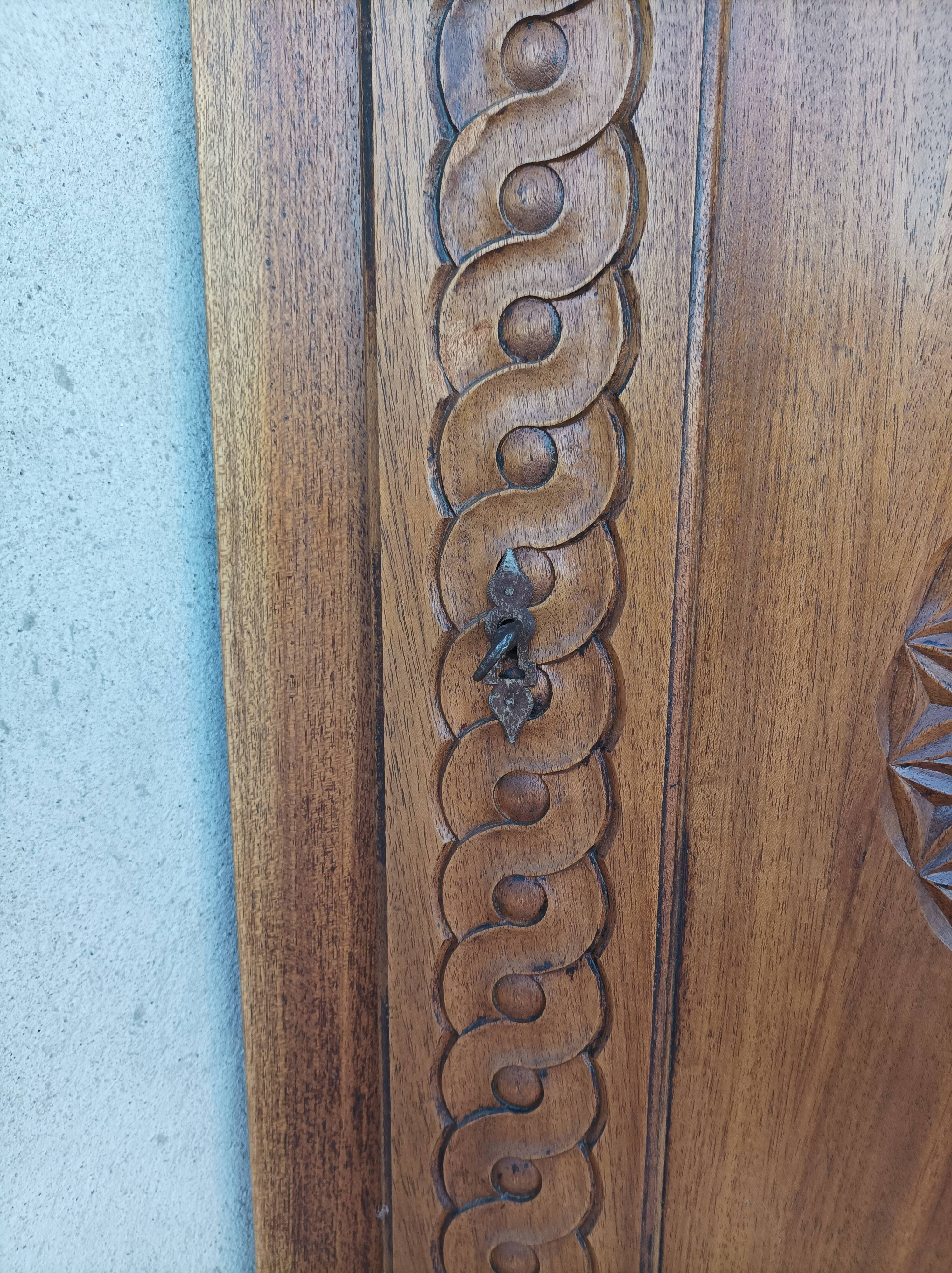 Corner cabinet in carved walnut, Savoyard style.
