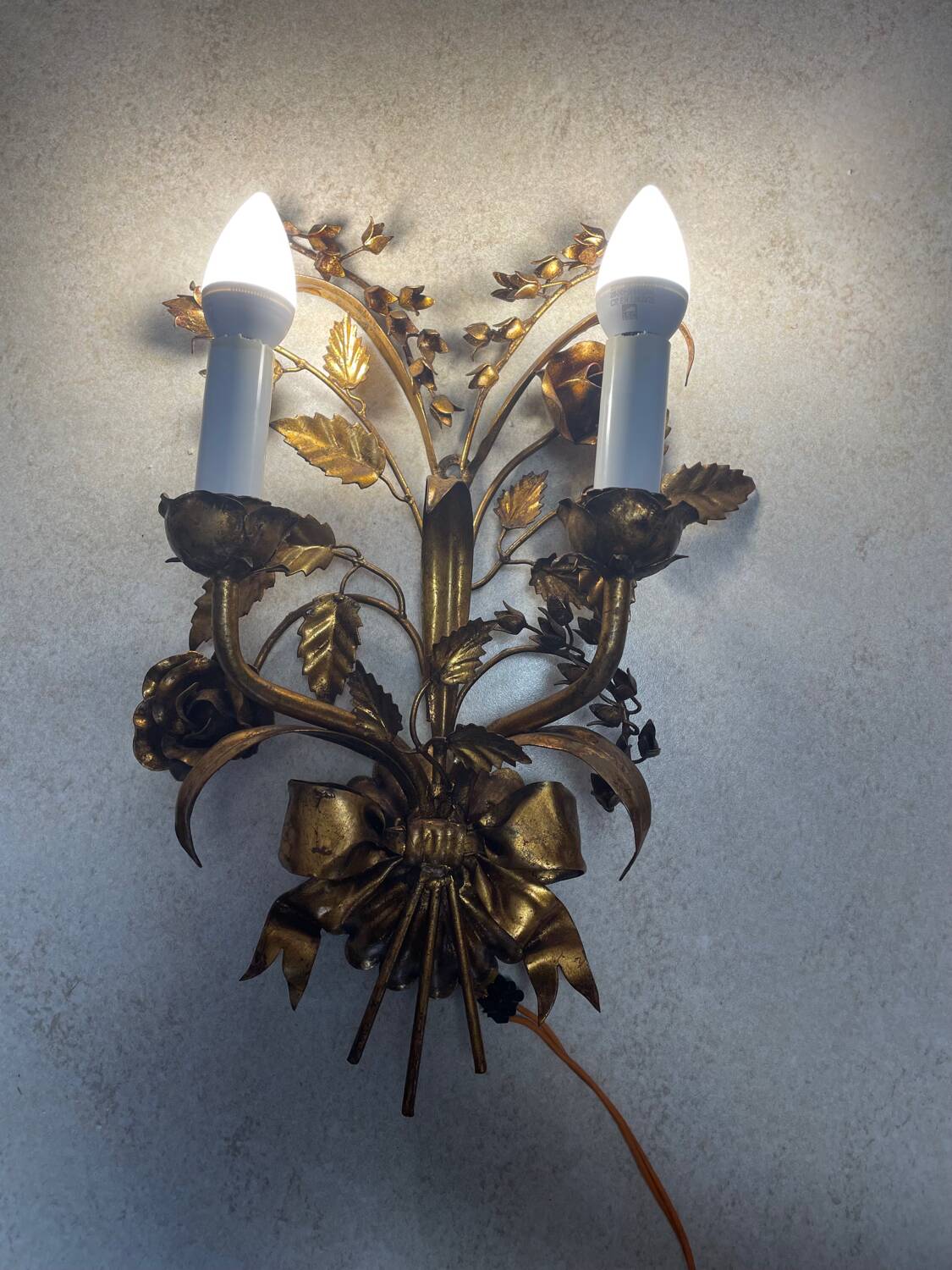 Wall light in the style of Hans Kögl, mid-20th century.