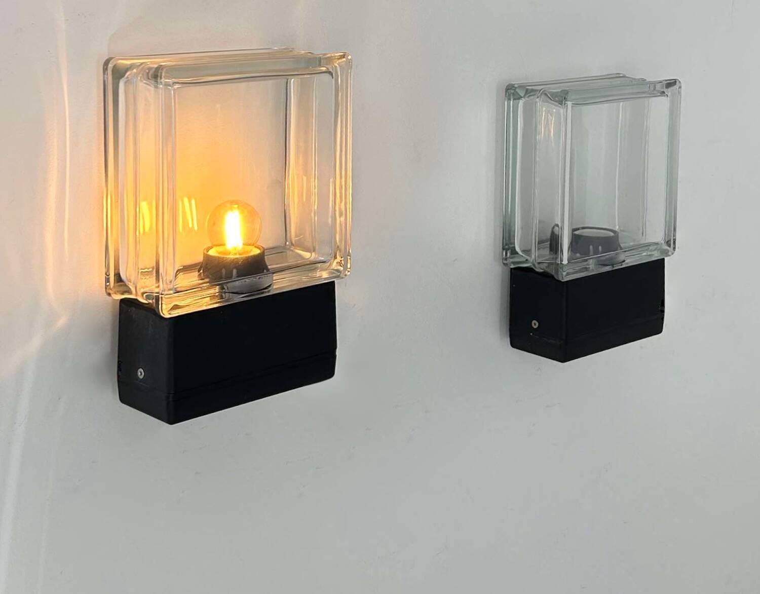 Pair of vintage wall lights, glass and black metal, Italy 1980