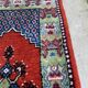 Vintage hand-knotted wool rug with polychrome decoration on a red, blue, green background 150 x 63 cm