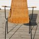 Rattan and steel armchair
