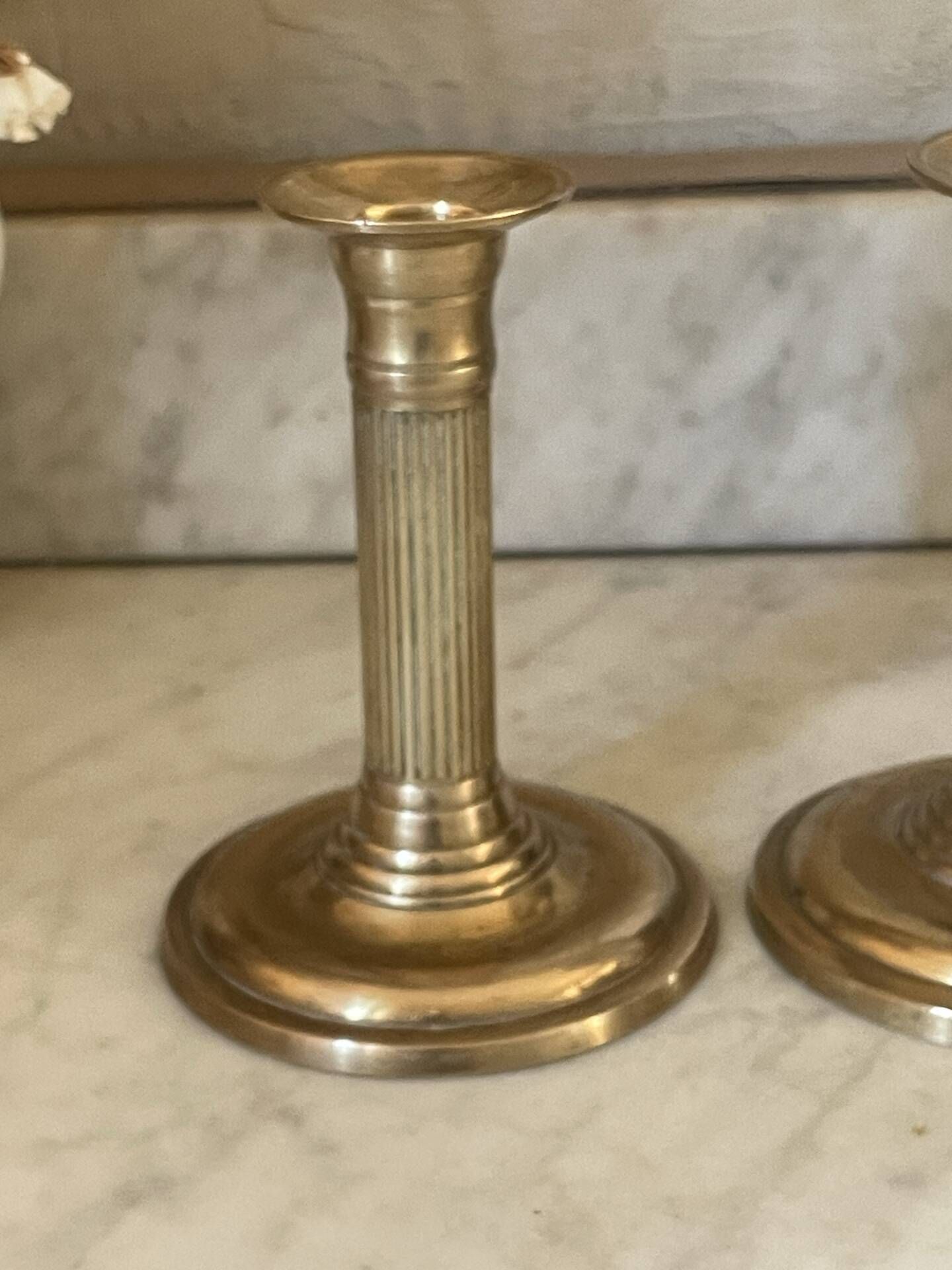 Pair of fluted column candlesticks in brass