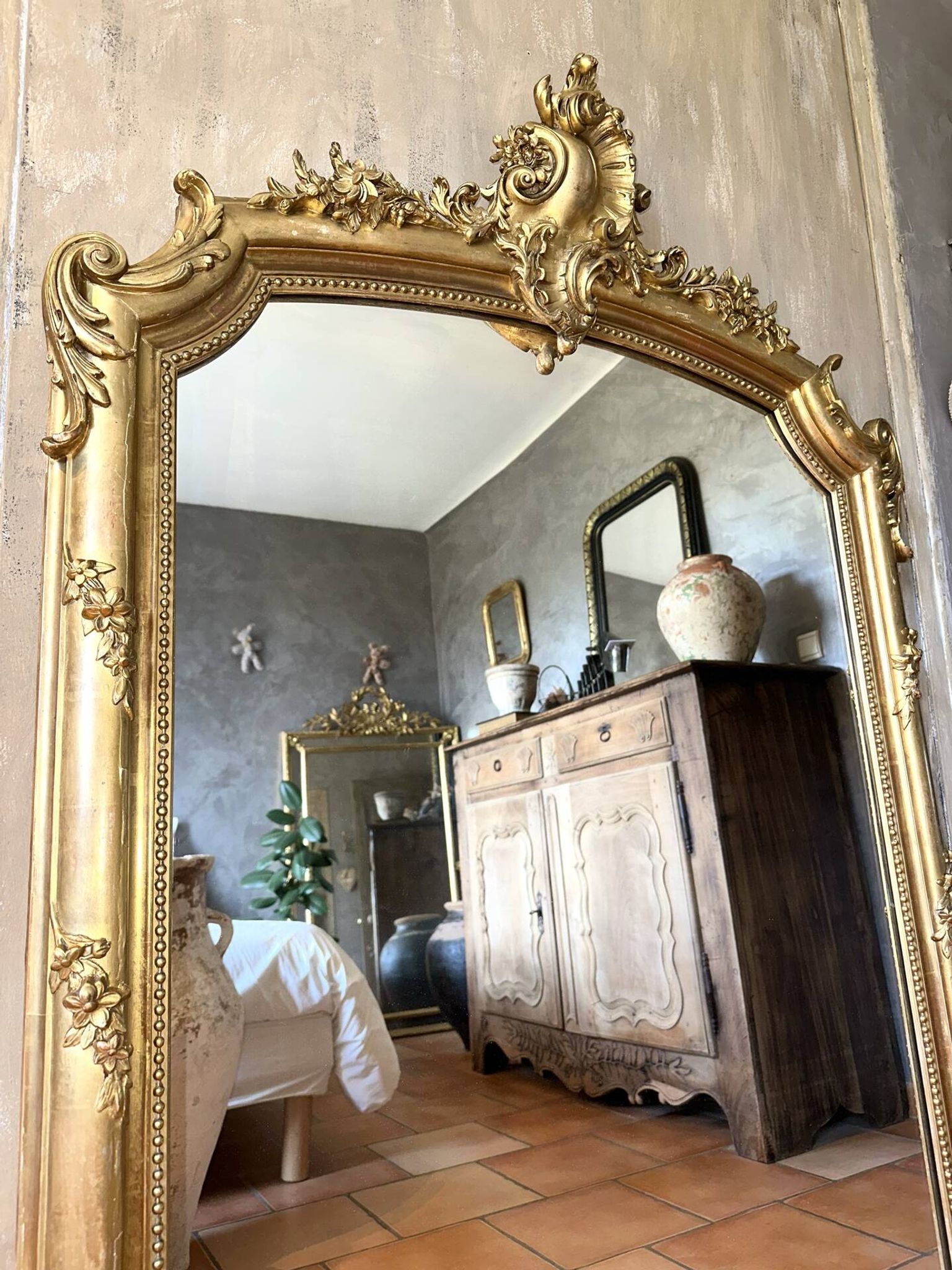 19th-century gilded antique pediment mirror