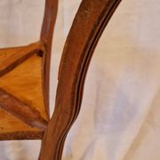 Antique Art Nouveau pedestal table with carved wood and marble top.
