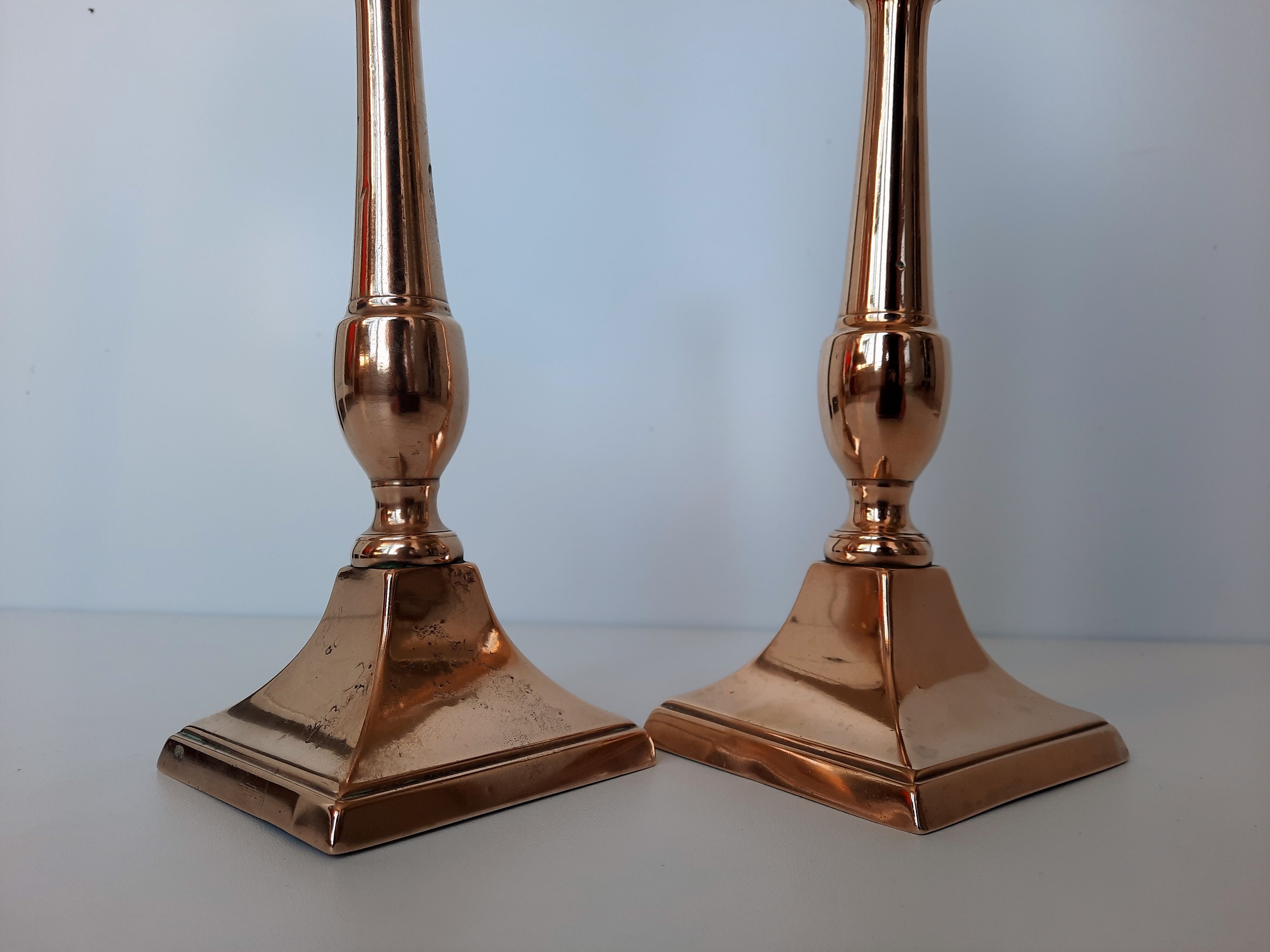 Pair of square foot copper candle holders