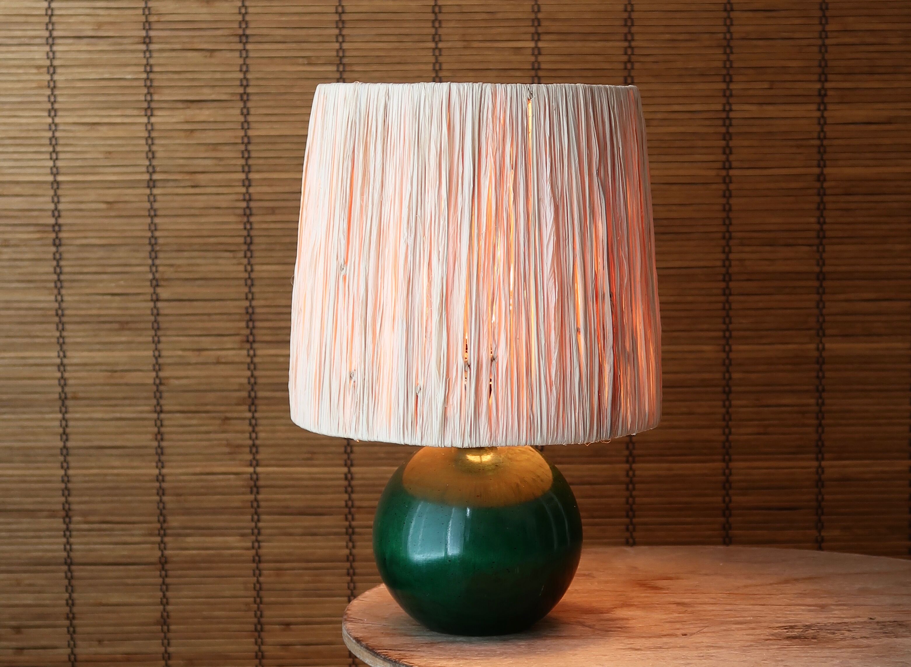 Lamp "ball" in green stained wood, raffia lampshade, 70s