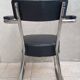 Vintage office chair in chrome metal and faux leather.