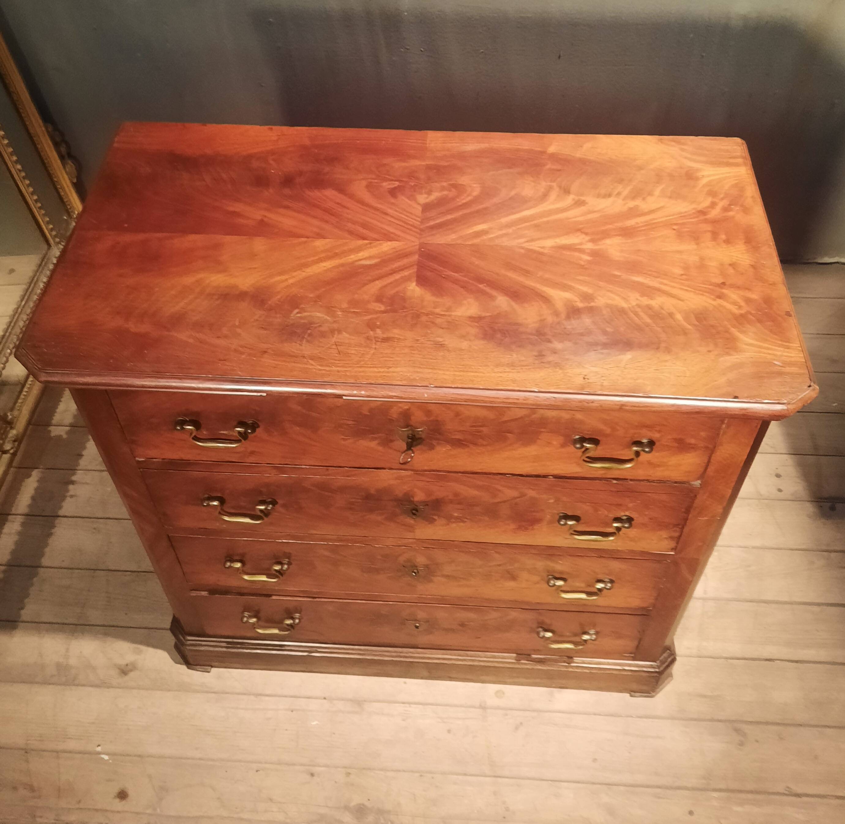 Small Louis Philippe chest of drawers with cut corners.