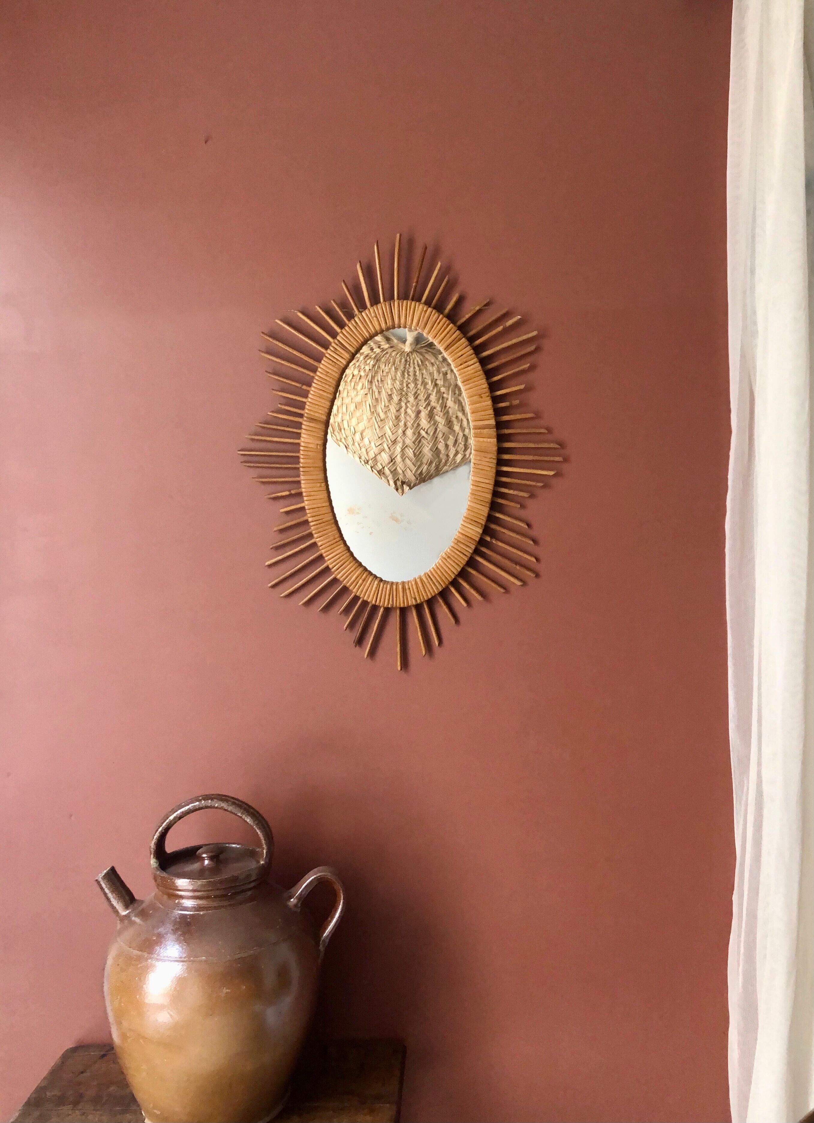 Oval rattan sun mirror