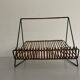 Mid-century black metal and rattan magazine rack, 1960, Italy